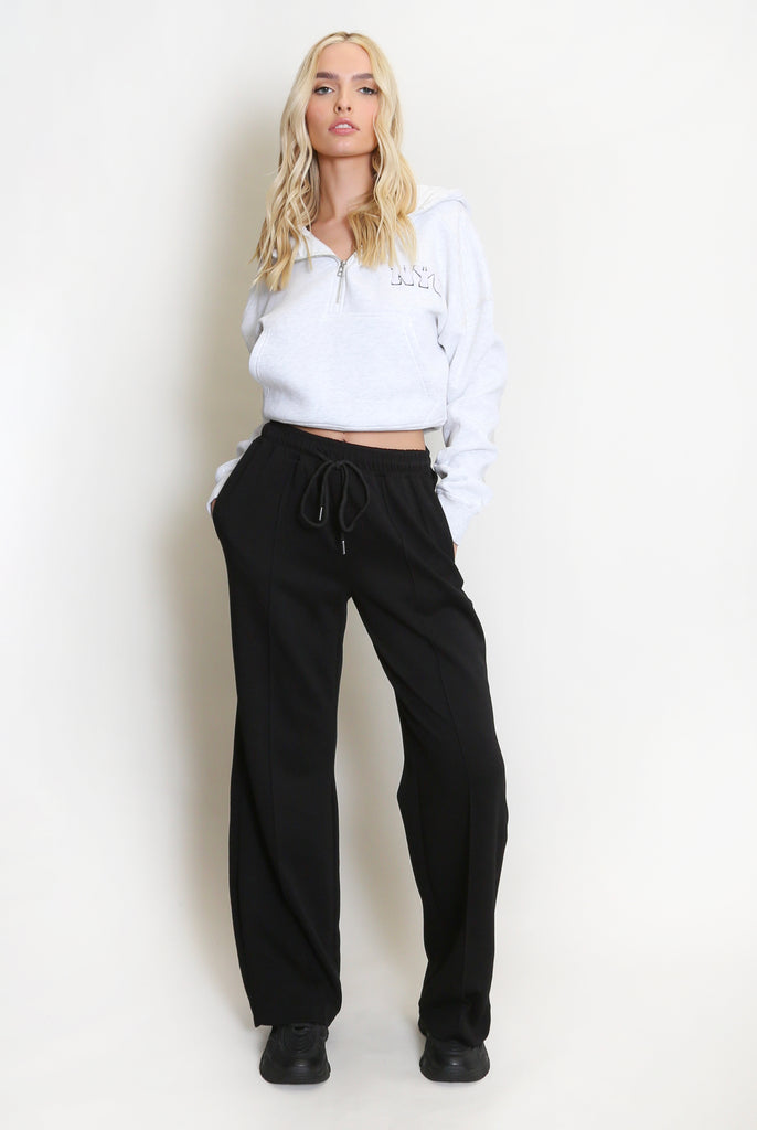 black wide leg seam front luxe joggers in black with a cropped NYC half zip sweat