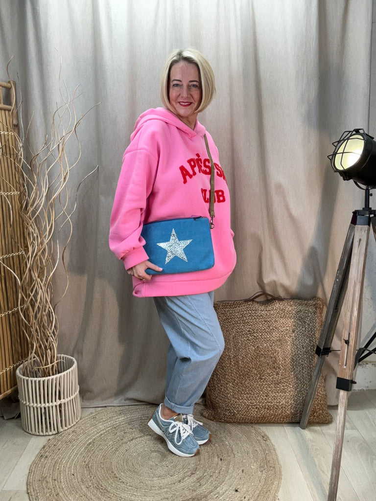 blue canvas crossbody bag with pink hoodie 