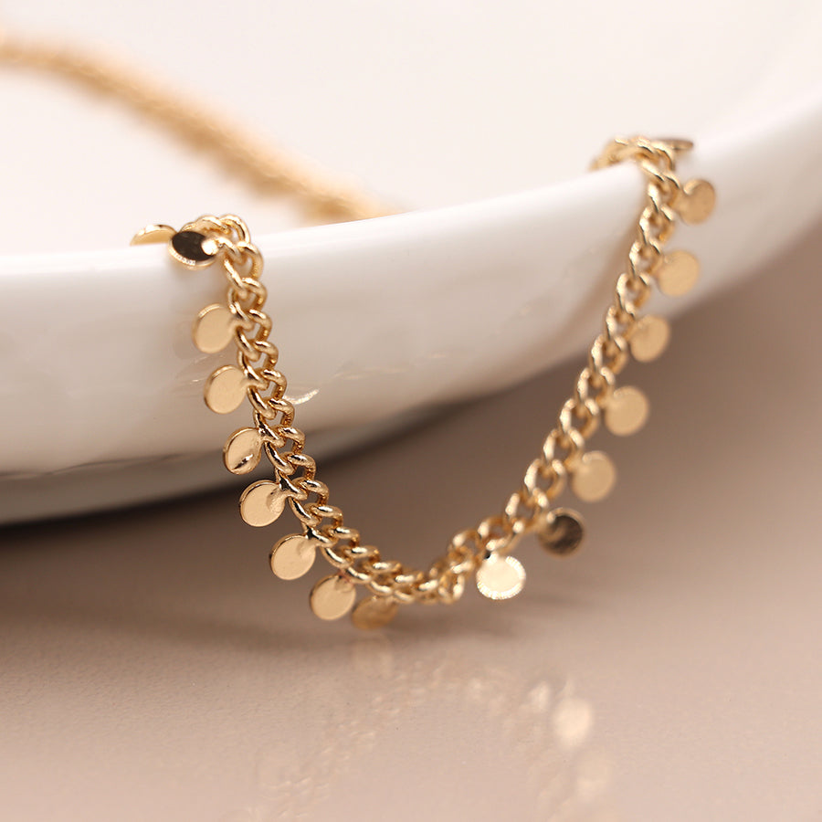 gold tiny discs necklace by POM