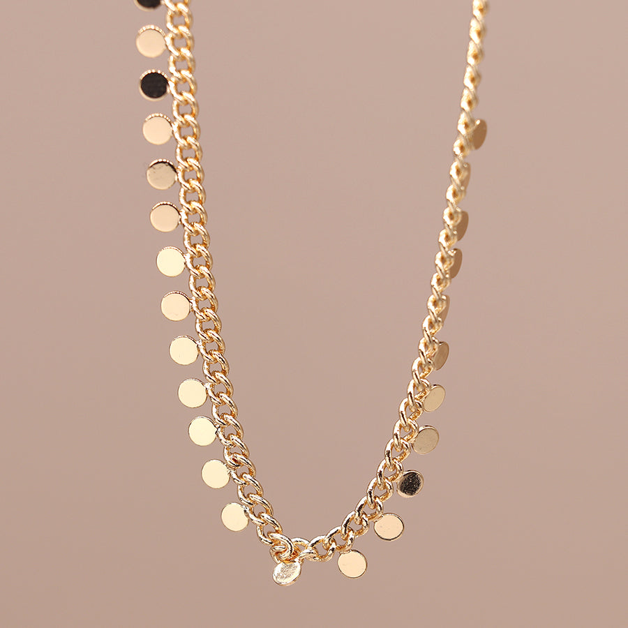 gold tiny discs necklace by POM