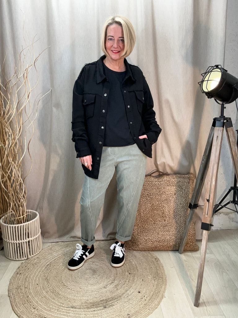 khaki acid wash relaxed magic trousers with a black tee and black jacket