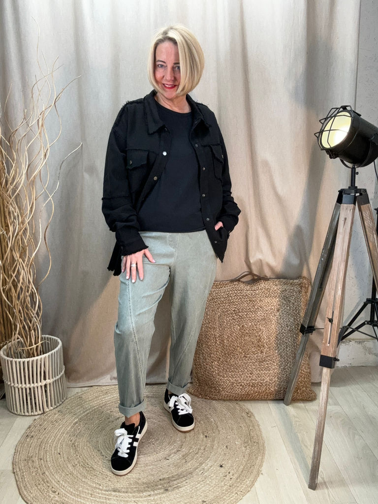 khaki relaxed magic trousers with a black jacket