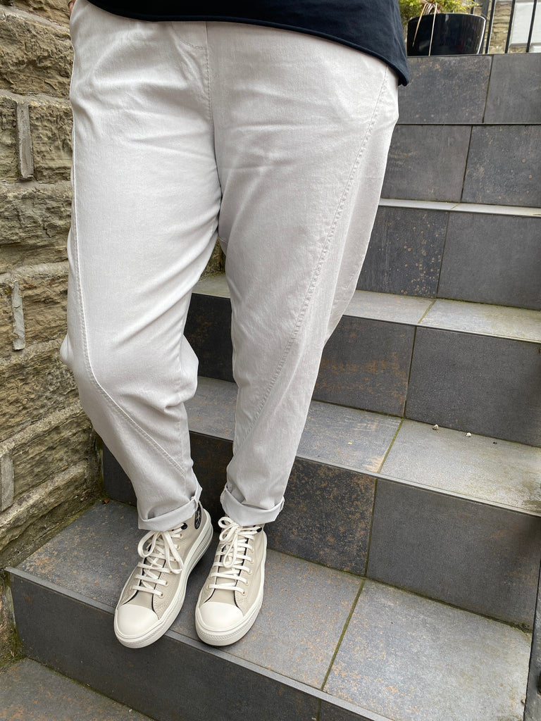 close up picture of grey acid wash relaxed magic trousers