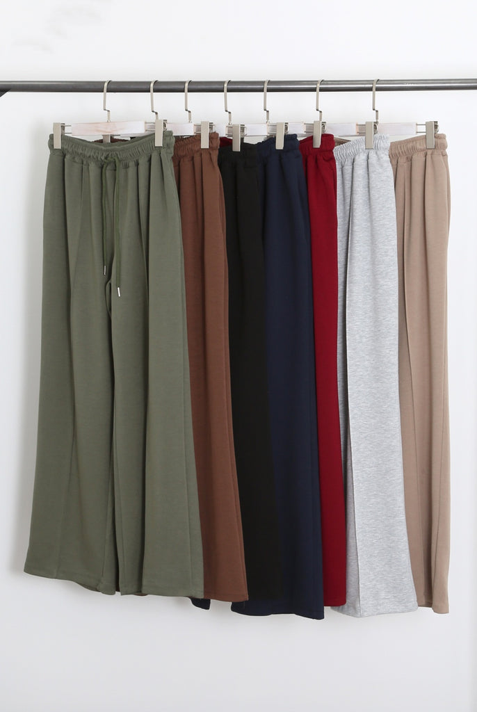 Luxe wide leg seam front joggers on hangers on a rail in khaki, black, navy, burgundy , grey and mocha