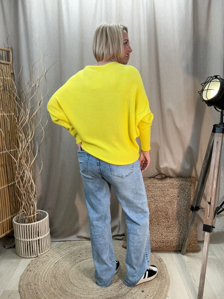 rear view of yellow slash neck batwing knit jumper